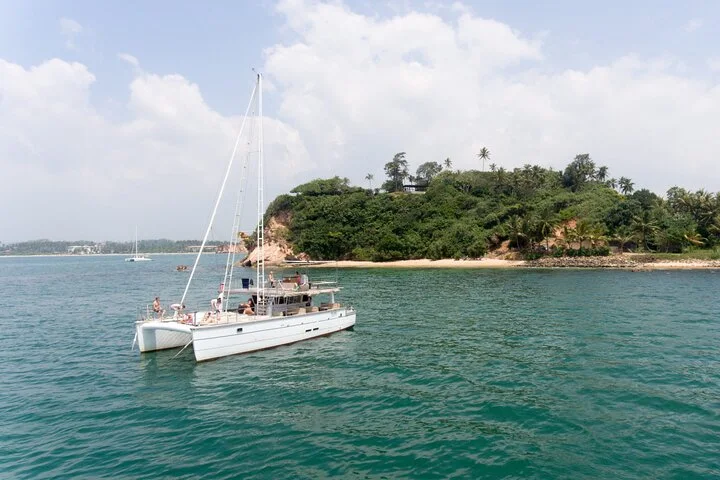 Private catamaran anchored off the coast of Mirissa